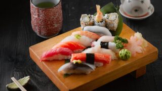 sushi on brown wooden board